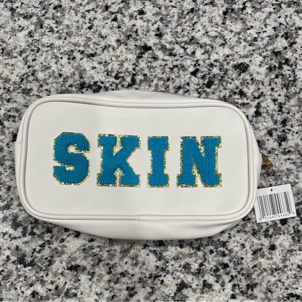 White Pouch with Blue and Gold 'SKIN' Design